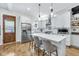 Beautifully updated kitchen with stainless steel appliances and an island with seating at 1322 Marlowe Ave, Indianapolis, IN 46202