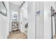 Bright laundry room features a sliding barn door, modern washer and dryer, and charming decor at 1322 Marlowe Ave, Indianapolis, IN 46202