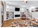 Inviting living room with fireplace, built-in bookshelves, and stairs leading to the upper level at 1322 Marlowe Ave, Indianapolis, IN 46202