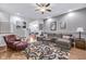 Comfortable living room with hardwood floors, a large sectional couch, and a ceiling fan at 1322 Marlowe Ave, Indianapolis, IN 46202