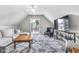 Bright living room features a neutral color palette, a ceiling fan, and access to a private outdoor deck at 1322 Marlowe Ave, Indianapolis, IN 46202