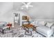 Cozy living room provides ample seating, a neutral color palette, and a stylish area rug at 1322 Marlowe Ave, Indianapolis, IN 46202