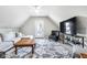 Cozy living room with vaulted ceilings, natural light, and comfortable seating, perfect for relaxation at 1322 Marlowe Ave, Indianapolis, IN 46202