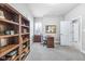 Home office includes built-in shelving, natural light, and a neutral color scheme at 1322 Marlowe Ave, Indianapolis, IN 46202