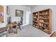 Functional home office with computer, built-in shelving, and a large window at 1322 Marlowe Ave, Indianapolis, IN 46202