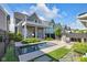 Backyard featuring covered porch, second story balcony, modern pool and outdoor kitchen at 1322 Marlowe Ave, Indianapolis, IN 46202