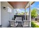 Covered porch featuring comfortable seating and view of landscaped backyard at 1322 Marlowe Ave, Indianapolis, IN 46202