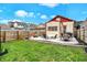 Spacious backyard with patio, fire pit, and ample green space, perfect for outdoor activities at 1333 Spann Ave, Indianapolis, IN 46203
