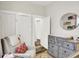 Cozy Bedroom showcases a plush rocking chair, a dresser with changing pad, and soft, neutral colors at 1333 Spann Ave, Indianapolis, IN 46203