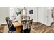 Stylish dining room with wood table, black chairs, and views into other rooms at 1333 Spann Ave, Indianapolis, IN 46203