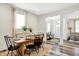 Bright dining room with wood table, natural light, and view into the living area at 1333 Spann Ave, Indianapolis, IN 46203