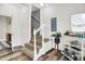 Inviting entryway featuring a staircase, stylish flooring, and bright, neutral decor at 1333 Spann Ave, Indianapolis, IN 46203