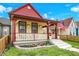 Inviting home featuring a cozy front porch and a well-kept yard at 1333 Spann Ave, Indianapolis, IN 46203