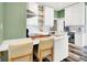 Well-equipped kitchen featuring white cabinets, stainless appliances, hardwood floors, and an island at 1333 Spann Ave, Indianapolis, IN 46203