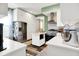 Bright kitchen with stainless appliances, hardwood floors, island, and ample storage at 1333 Spann Ave, Indianapolis, IN 46203
