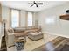 Bright living room with large sectional couch, natural light, and stylish decor at 1333 Spann Ave, Indianapolis, IN 46203