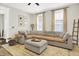 Bright living room with large sectional couch, natural light, and stylish decor at 1333 Spann Ave, Indianapolis, IN 46203