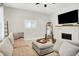 Cozy living room featuring a large couch, fireplace, and decorative mirror with hardwood floors at 1333 Spann Ave, Indianapolis, IN 46203