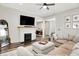 Cozy living room with fireplace, TV, and comfortable sectional sofa at 1333 Spann Ave, Indianapolis, IN 46203