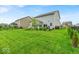 This home features a lush backyard and patio at 13495 Forest Glade Dr, Fishers, IN 46037