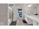 This bathroom features a glass shower, an ensuite bathroom, and a double vanity at 13495 Forest Glade Dr, Fishers, IN 46037