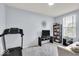 Bright bedroom featuring a large window, a ceiling fan, and neutral paint, providing a comfortable living space at 13495 Forest Glade Dr, Fishers, IN 46037