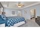 This bedroom features a tray ceiling, ensuite bathroom, and neutral walls at 13495 Forest Glade Dr, Fishers, IN 46037