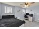 This bedroom is equipped with carpet, a ceiling fan, and a desk area at 13495 Forest Glade Dr, Fishers, IN 46037