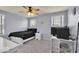 This cozy bedroom boasts plush carpet, a ceiling fan, and bright windows at 13495 Forest Glade Dr, Fishers, IN 46037