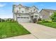 Lovely two-story home boasts a well-maintained lawn and an attached two car garage, perfect for a Gathering at 13495 Forest Glade Dr, Fishers, IN 46037