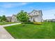 Beautiful two-story home with a green lawn and professional landscaping offers great curb appeal in a desirable neighborhood at 13495 Forest Glade Dr, Fishers, IN 46037