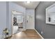 Inviting foyer showcases a wood floor, with a view into the light-filled living room, and front door at 13495 Forest Glade Dr, Fishers, IN 46037