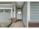 Close-up of the home's entry, highlighting the sidelight windows, attached two car garage, and craftsman details at 13495 Forest Glade Dr, Fishers, IN 46037