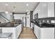 Modern kitchen boasts a large island with seating and stainless steel appliances at 13495 Forest Glade Dr, Fishers, IN 46037
