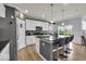 Modern kitchen with stainless steel appliances, granite countertops, and a functional island with bar stool seating at 13495 Forest Glade Dr, Fishers, IN 46037