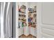 Walk-in pantry featuring shelving stocked with a variety of food items and household goods at 13495 Forest Glade Dr, Fishers, IN 46037