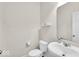 This powder room has a toilet, sink, and a neutral color palette at 13495 Forest Glade Dr, Fishers, IN 46037