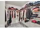 Organized walk-in closet with shelving and hanging space for clothes and accessories at 13495 Forest Glade Dr, Fishers, IN 46037