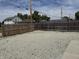 Wide backyard area enclosed by a wood fence offering privacy, space, and a gravel foundation at 1518 S Talbott St, Indianapolis, IN 46225