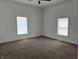 Spacious bedroom with two windows and neutral carpeting at 1518 S Talbott St, Indianapolis, IN 46225