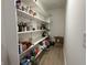 Walk-in pantry with ample white shelving providing plenty of storage space for food and kitchen essentials at 1518 S Talbott St, Indianapolis, IN 46225