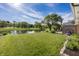 Beautiful backyard featuring a pond, lush greenery, and an outdoor deck, perfect for enjoying nature at 15388 Follow Dr, Noblesville, IN 46060