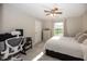 Neutral bedroom with ceiling fan, carpet floors, and a work/study area at 15388 Follow Dr, Noblesville, IN 46060