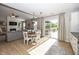 Open dining area with a view of the backyard, seamlessly connected to the living room and kitchen at 15388 Follow Dr, Noblesville, IN 46060
