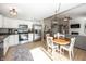 Bright kitchen with stainless steel appliances, white cabinets, and an adjacent dining area at 15388 Follow Dr, Noblesville, IN 46060