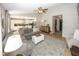 Open-concept living space with hardwood floors, neutral tones, and seamless flow to the kitchen at 15388 Follow Dr, Noblesville, IN 46060