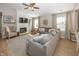 Spacious living room with a fireplace, large windows, and a comfortable seating arrangement at 15388 Follow Dr, Noblesville, IN 46060