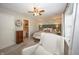 Comfortable main bedroom featuring a sitting area, floral wallpaper, and a view to bathroom at 15388 Follow Dr, Noblesville, IN 46060
