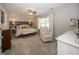 Spacious main bedroom with decorative wallpaper, a ceiling fan, and lots of natural light at 15388 Follow Dr, Noblesville, IN 46060