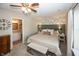 Inviting main bedroom with a cozy bed, accent wallpaper, and ensuite bathroom access at 15388 Follow Dr, Noblesville, IN 46060